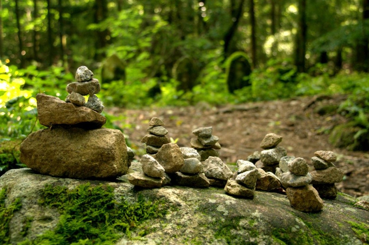 japanese stone statues in landscape